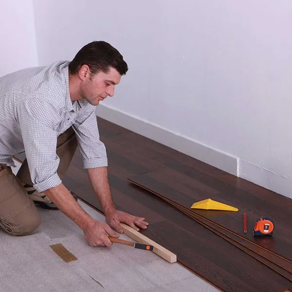 imgi_9_laminate_installation Worker installing laminate | Off-Price Carpet Outlet
