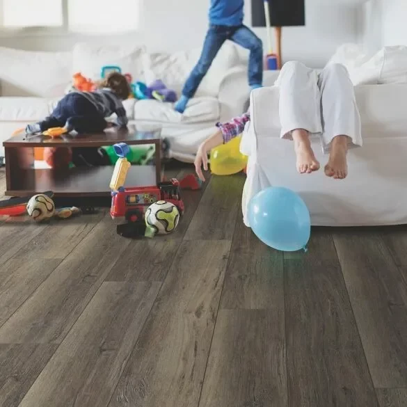 Kids playing in living room with balloons | Off-Price Carpet Outlet