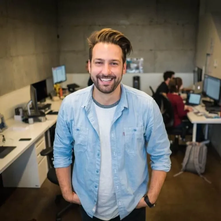 Happy man wearing blue jacket | Off-Price Carpet Outlet